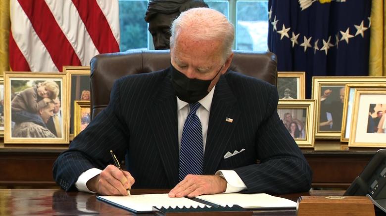 President Biden signing an Executive Order